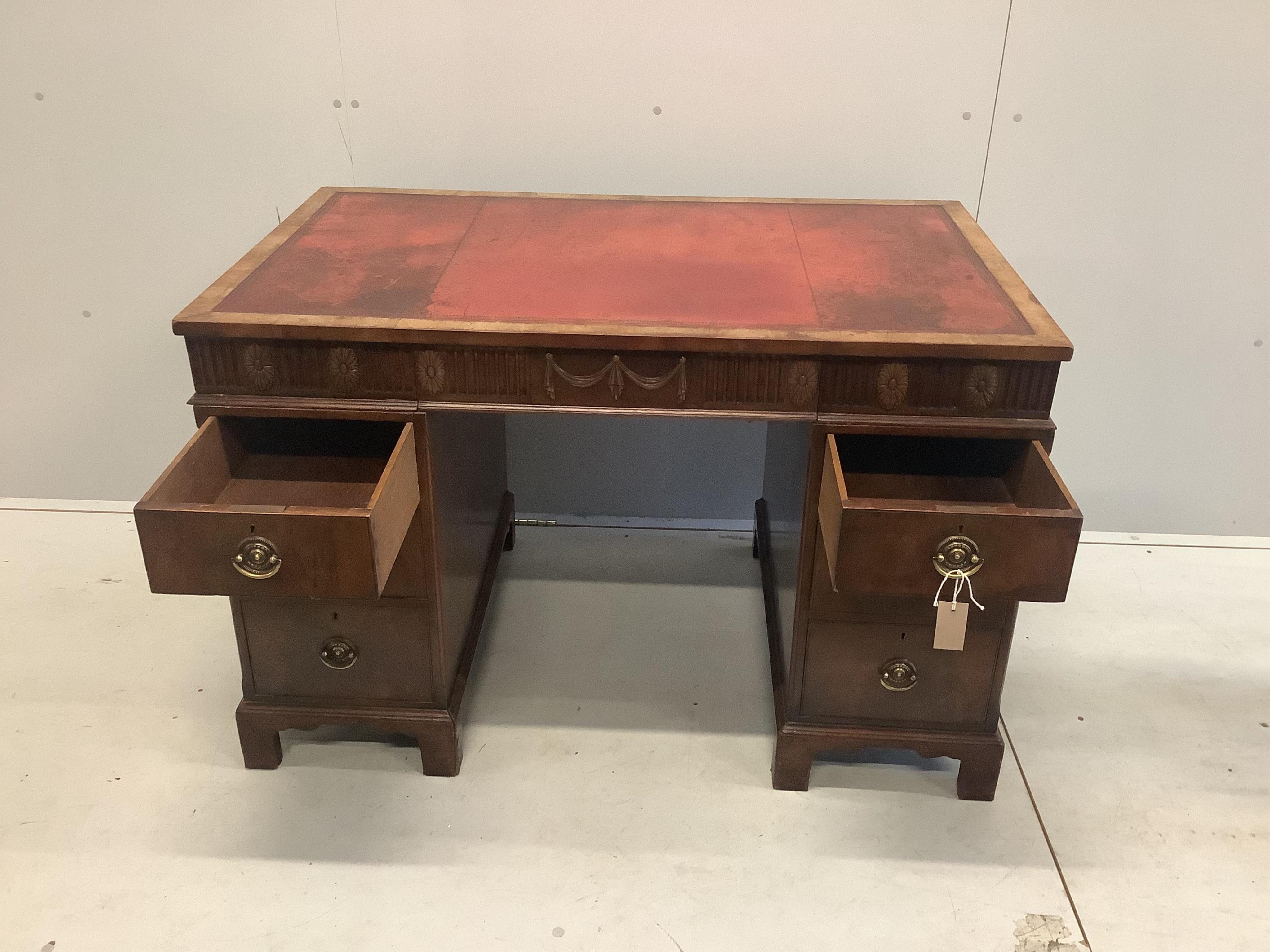 An early Georgian style walnut pedestal desk with inset leather top, width 117cm, depth 71cm, height 77cm. Condition - fair to good